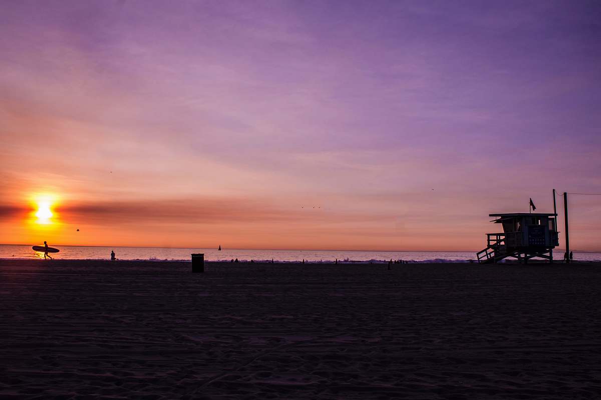 venice beach silhouette photography of house near sea at sunset los angeles